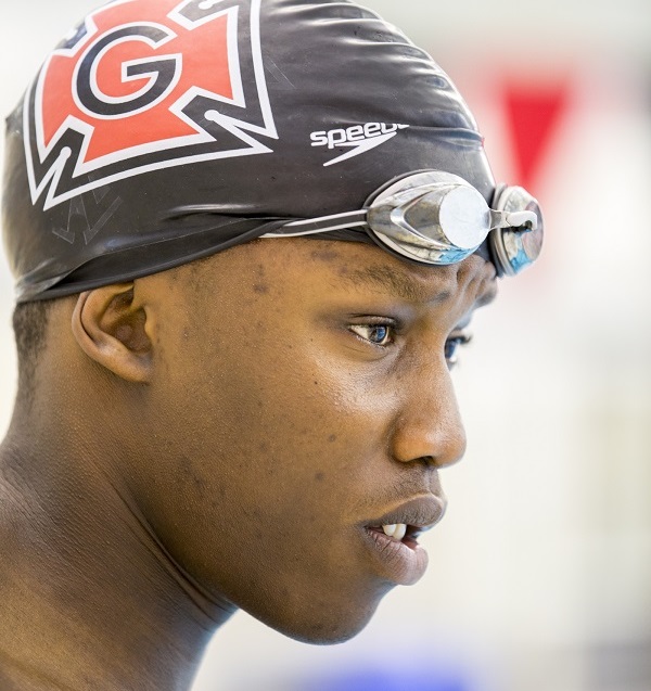 Joshua Tibatemwa a first-year student at Grinnell College gets ready to start a training session at the Russell K. Osgood Pool located in the Charles Benson Bear '39 Recreation and Athletic Center for a possible trip to Rio and the 2016 Summer Olympics where he could represent his home country of Uganda. (Photo by Justin Hayworth/Grinnell College)