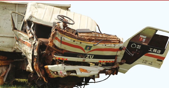 A mangled truck that was recently involved in an accident on Masaka road parked at Mpigi Police Headquarters. Independent/ Ronald Musoke