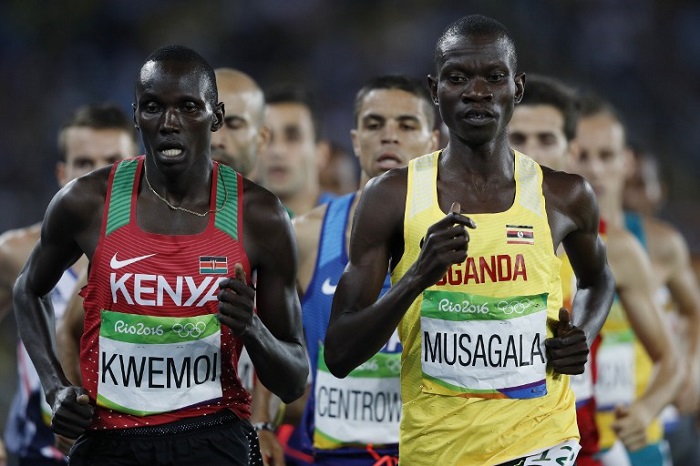 Kenya's Ronald Kwemoi (L) and Uganda's Ronald Musagala compete in the Men's 1500m Semifinal during the athletics event at the Rio 2016 Olympic Games at the Olympic Stadium in Rio de Janeiro on August 18, 2016. / AFP PHOTO / Adrian DENNIS
