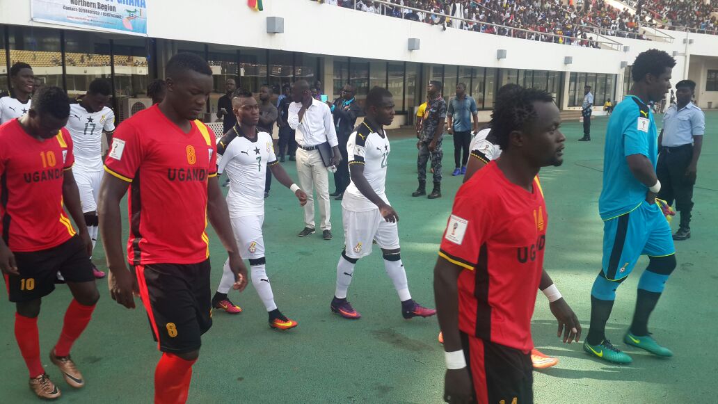 Cranes players walk onto the Tamale pitch